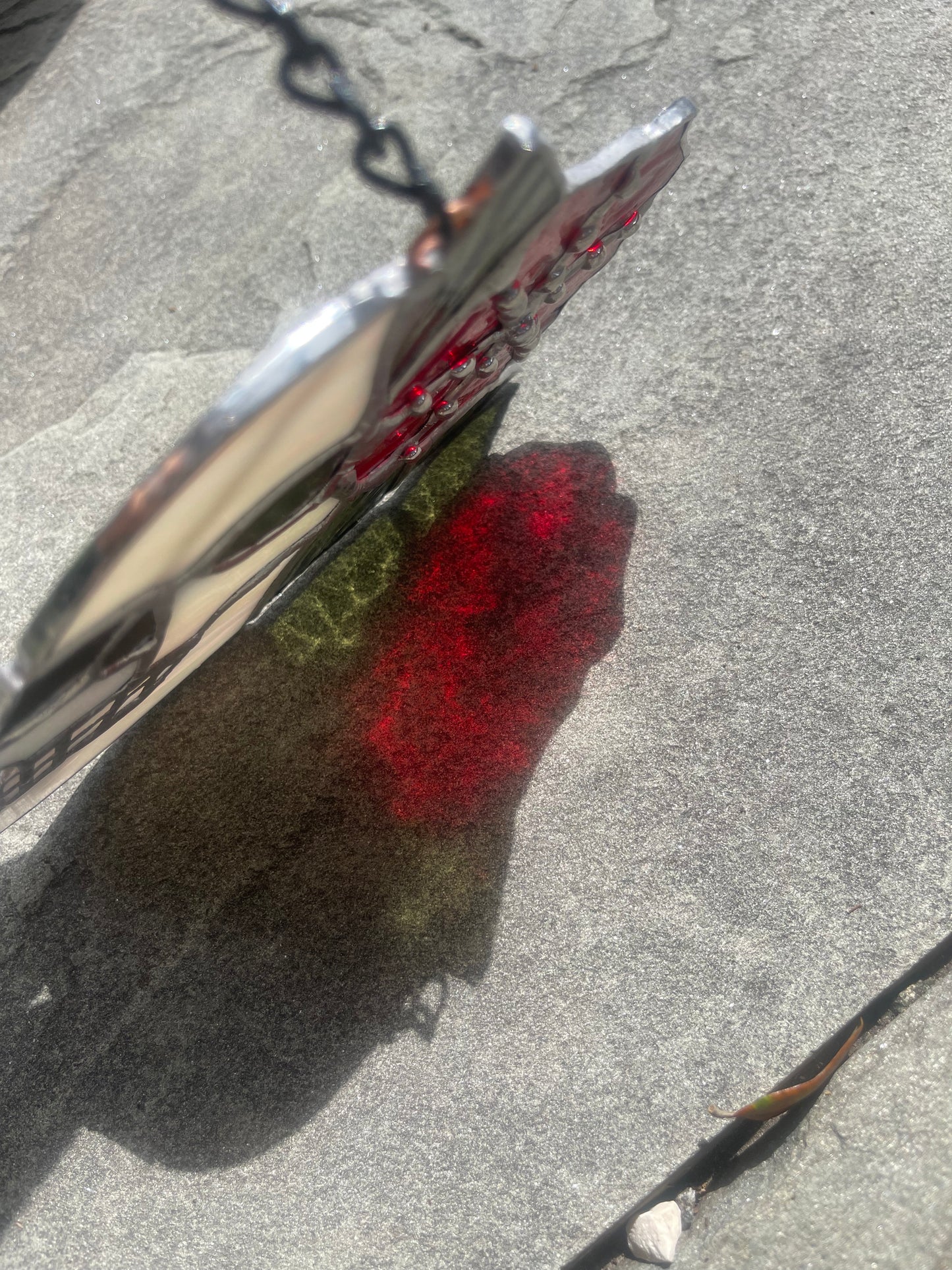 Skull with Iridescent White Glass and Red Flower